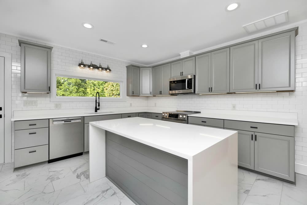 Classic shaker kitchen cabinets with a waterfall island